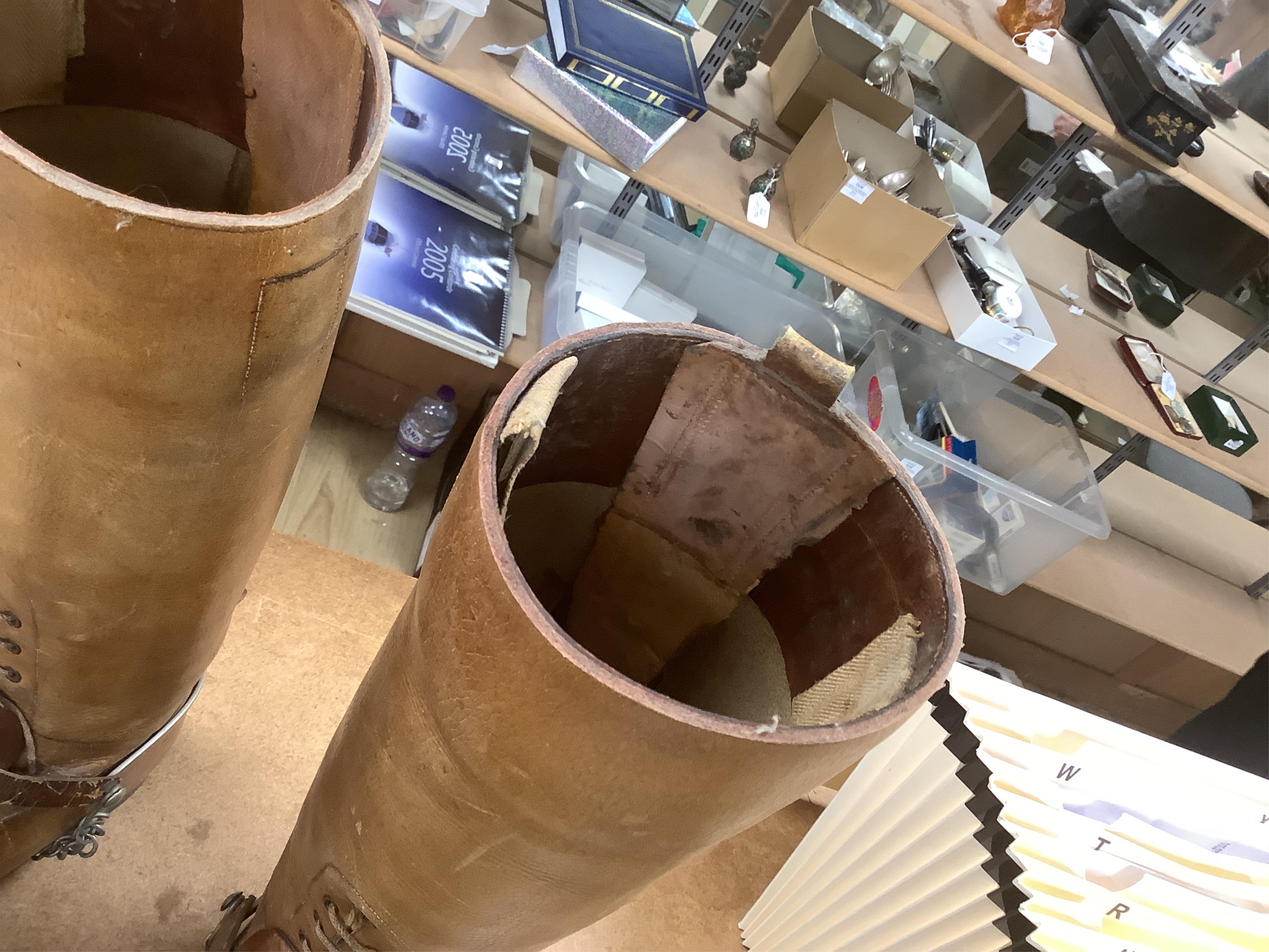 A pair of military First World War boots in tan leather, hobnail soles, two-part wooden shoe trees, and spurs. Condition - fair to good, some rubbing, fading and staining to the leather